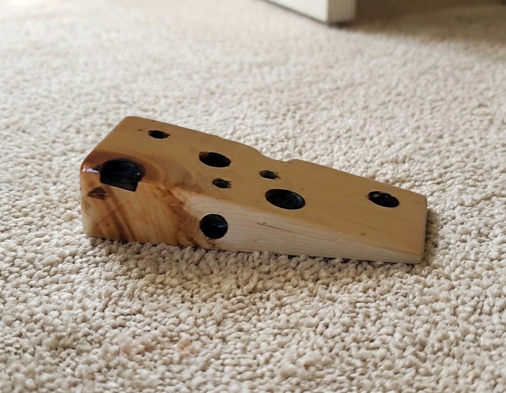 Wooden Swiss Cheese Doorstop Wedge