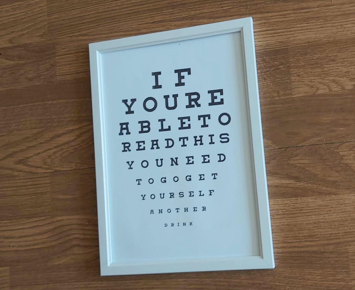 Eye chart sign DRINK